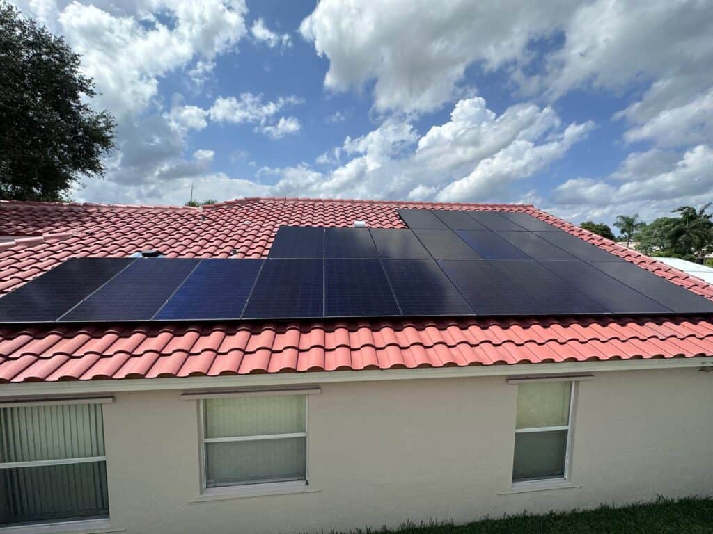 Technician diagnosing a solar system left without service by its original installer